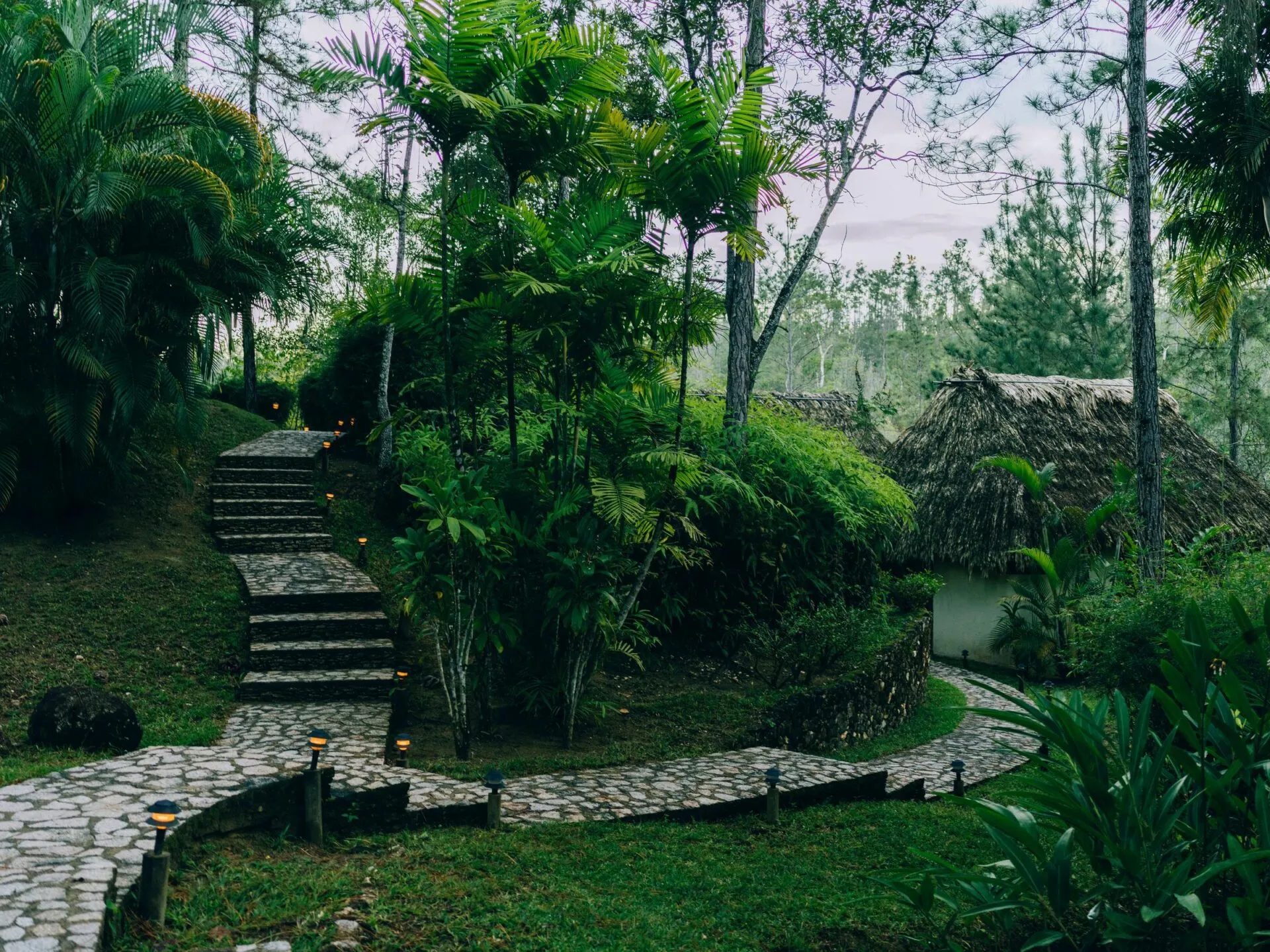 Stone walkways and lush vegetation at Blancaneaux Lodge, Belize