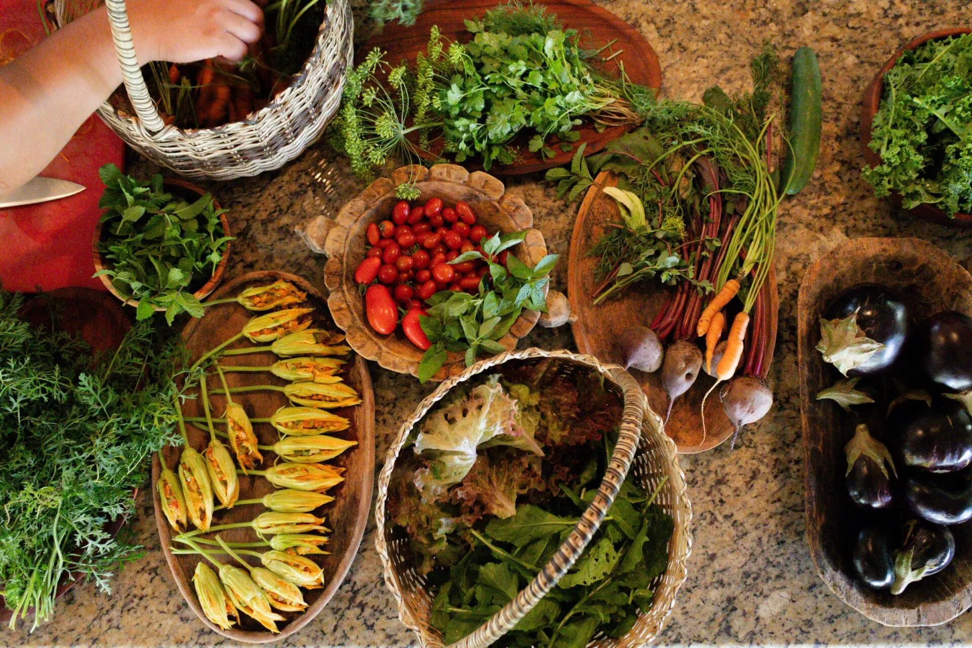 Vegetables from the garden being prepared at The Garden Spot at Blancaneaux Lodge