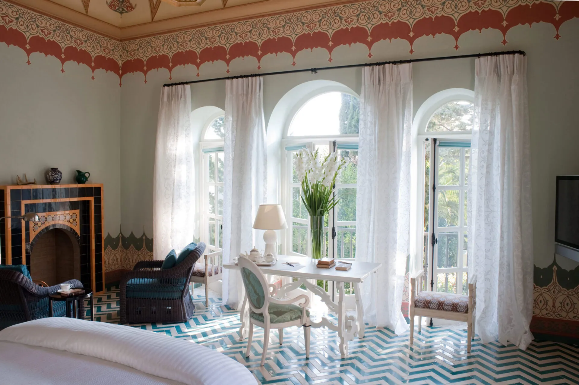 Suite bedroom with a tile floor, living area and windows