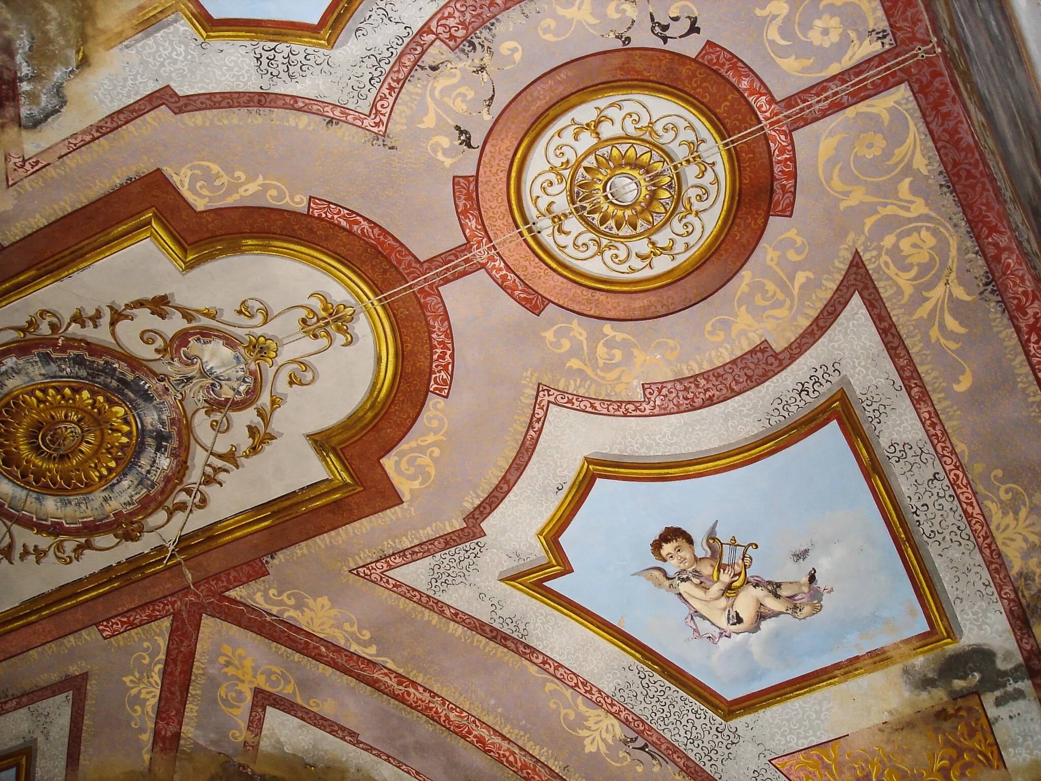Ceilings painted angels bordered in red and gold