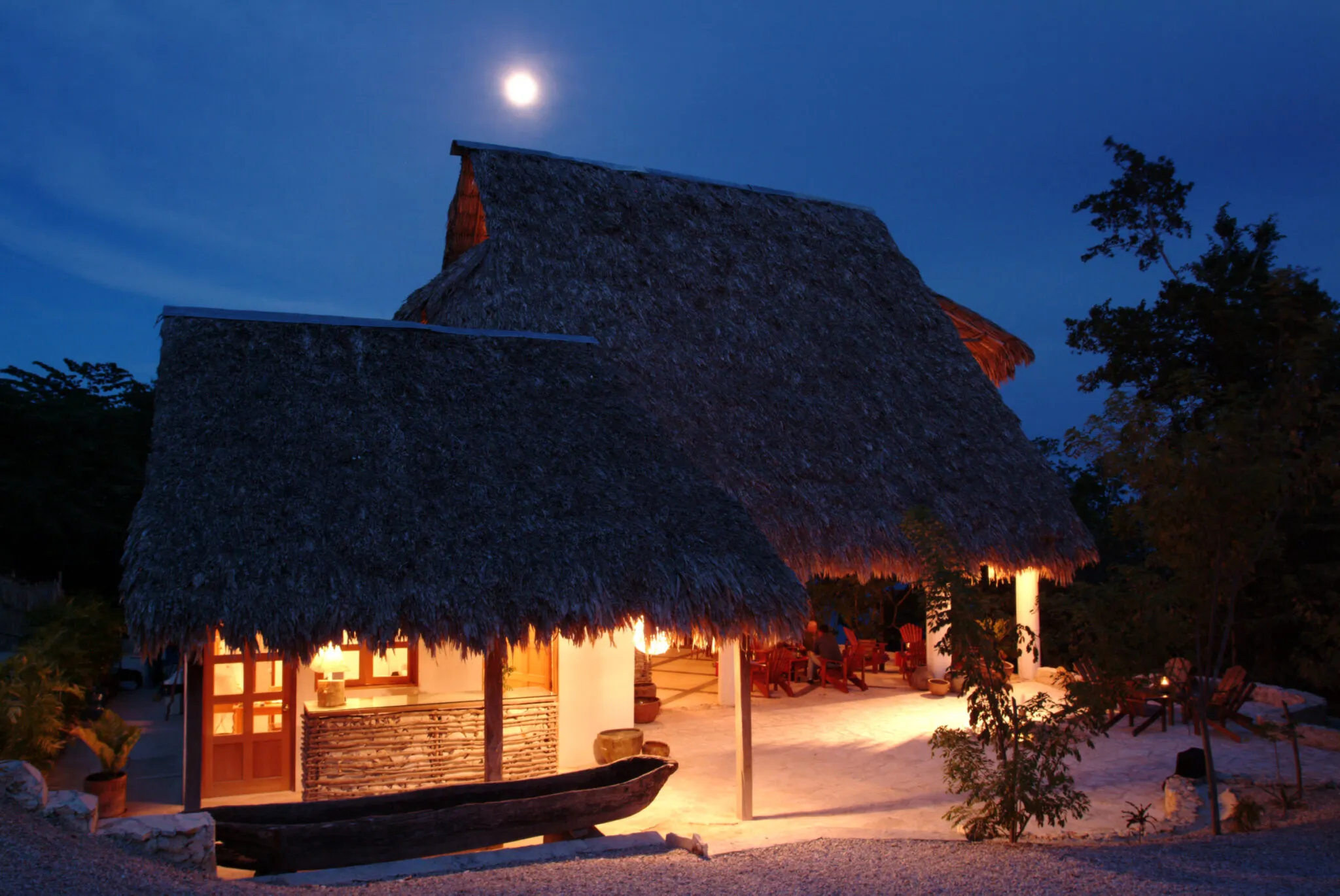 The outside of the Main Lodge at La Lancha at twilight.