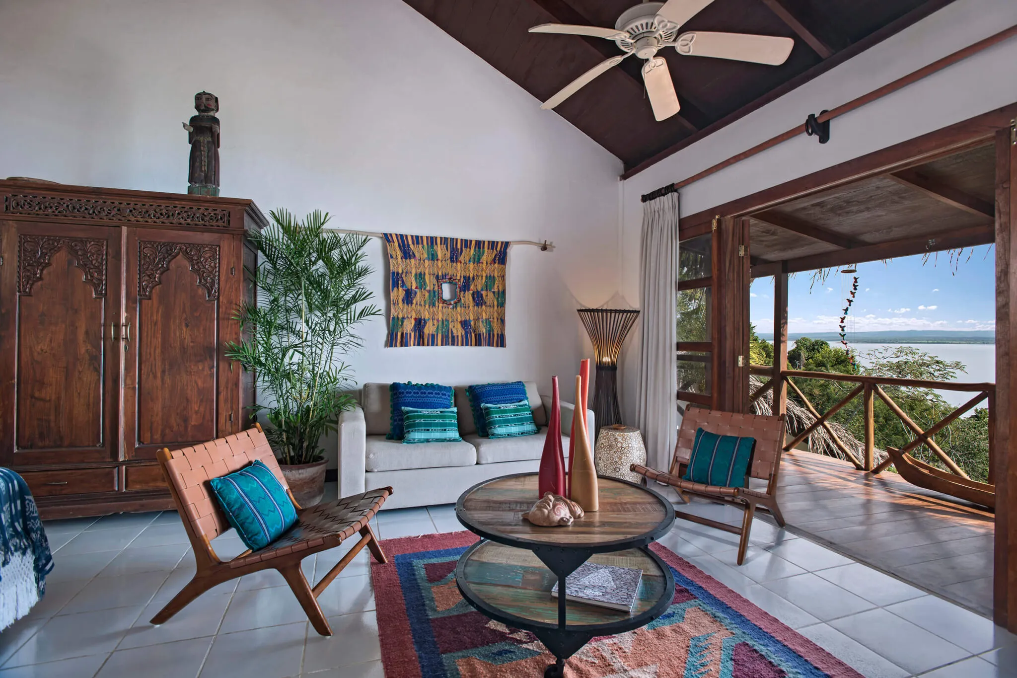 A view of the bright, white living area in a Lakeview Suite at La Lancha.