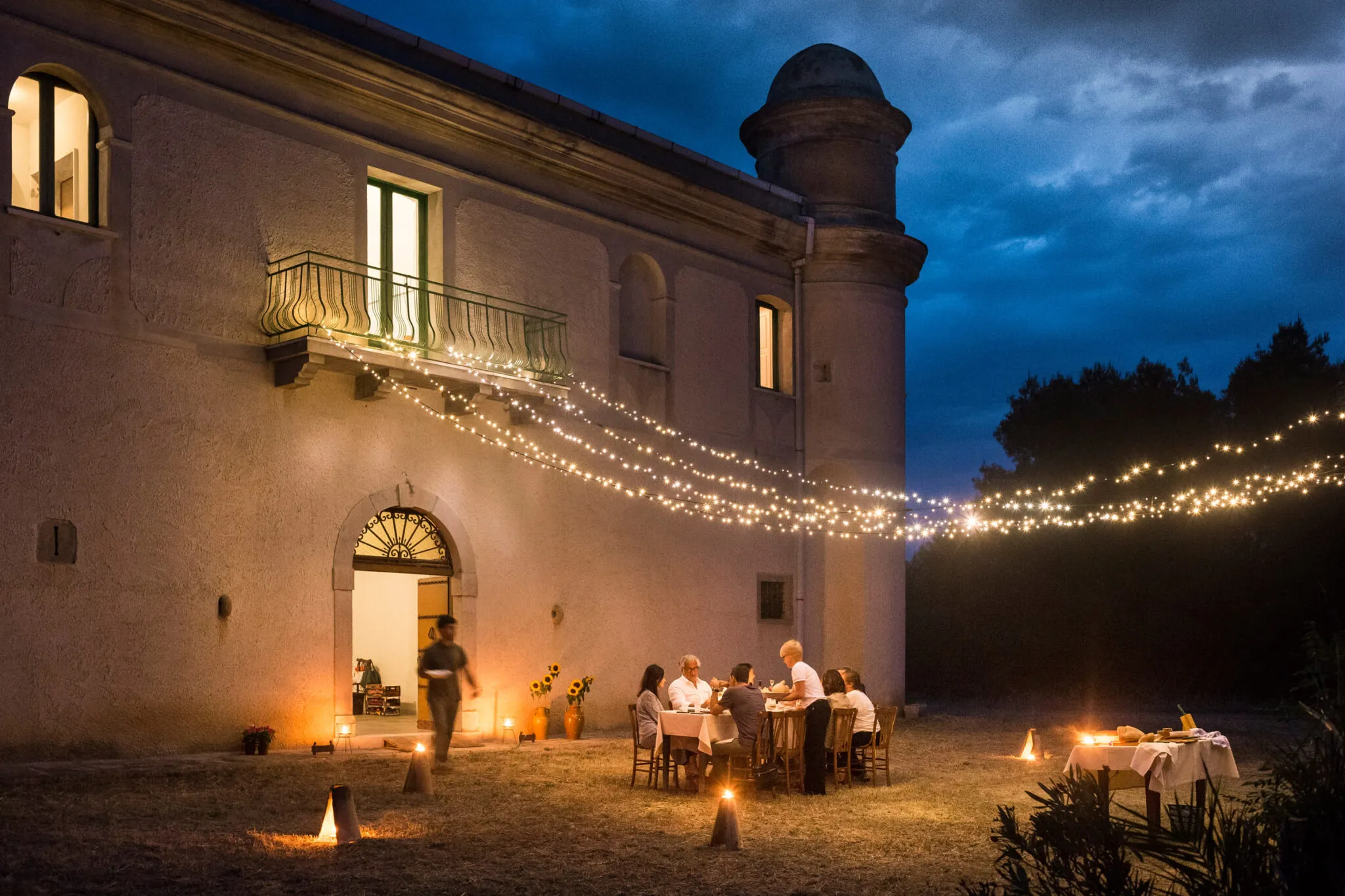 Outdoor dining under string lights at Masseria