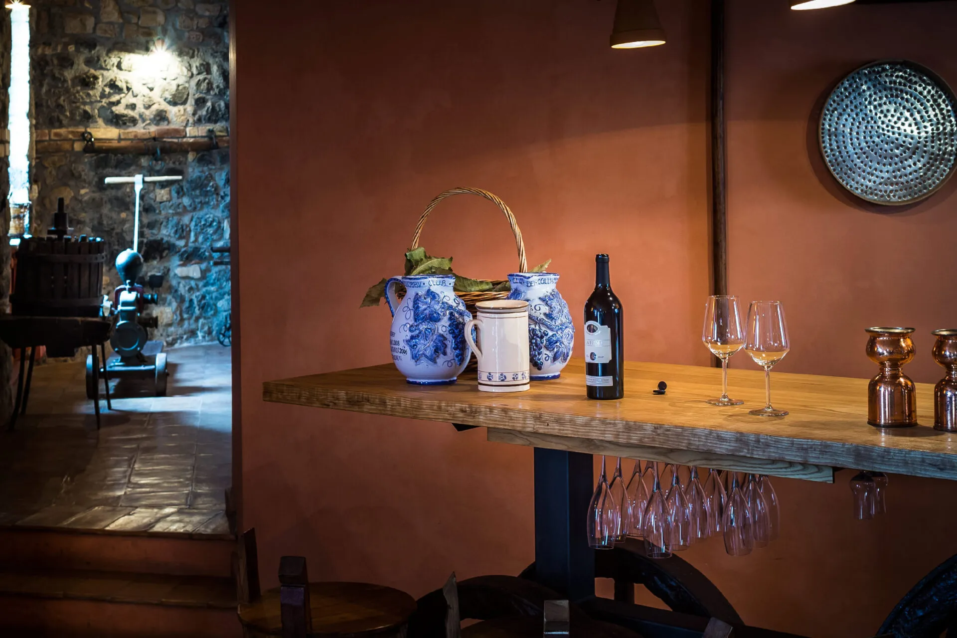 Open bottle of wine with two glasses on a table