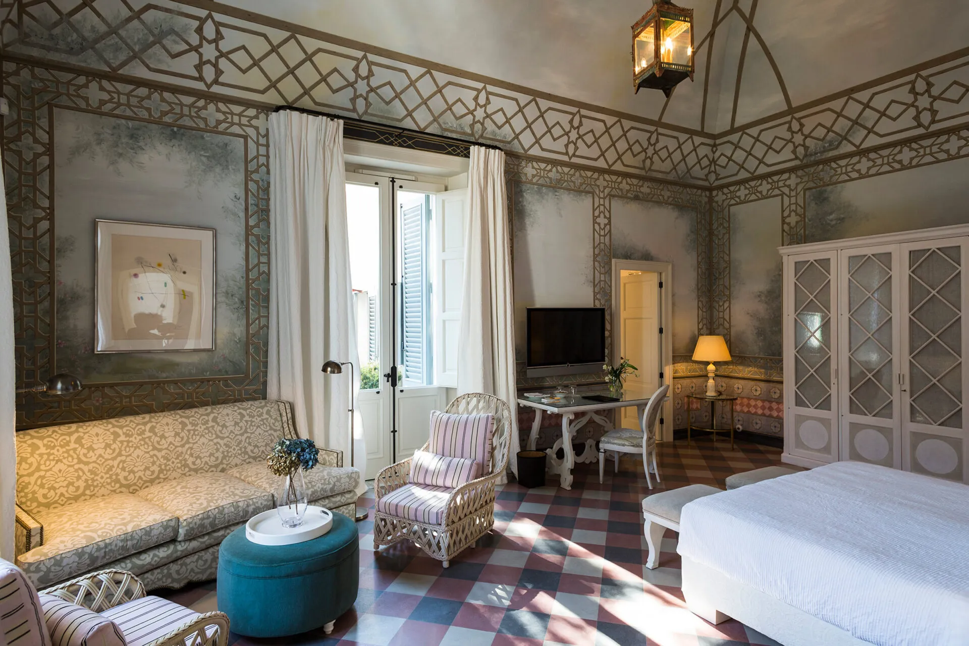 Bed and seating area in suite four