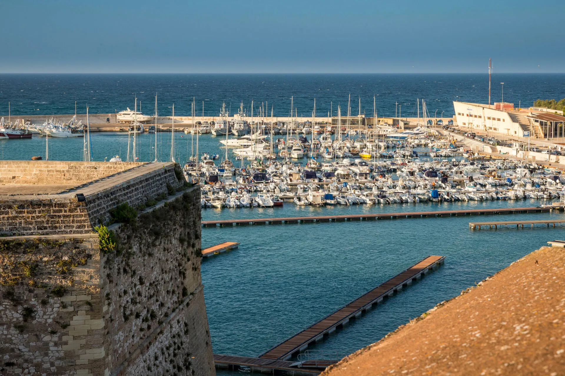 Boats docked at the harbor in Otranto