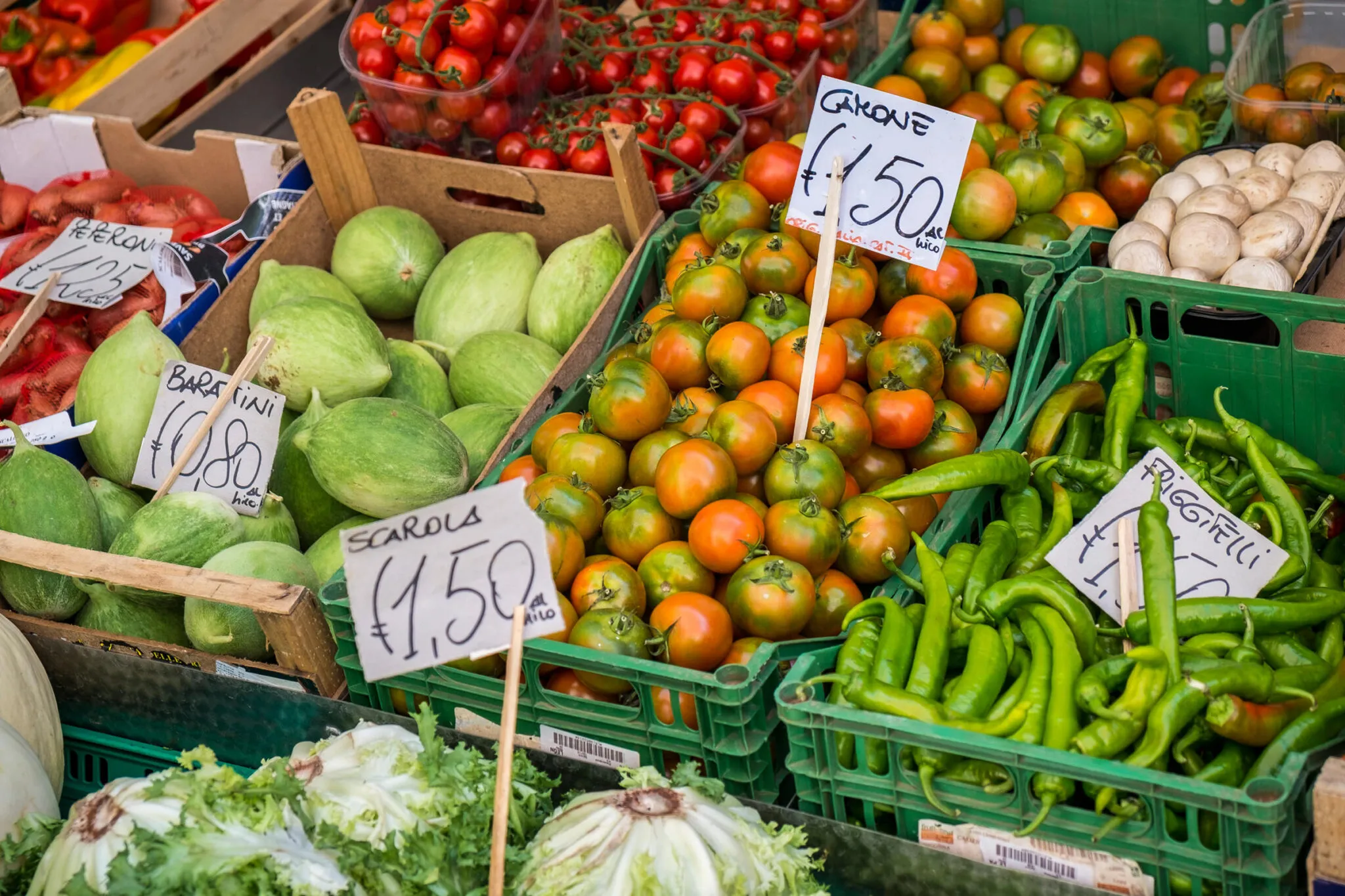 crates of vegetables for sale at a farmers market