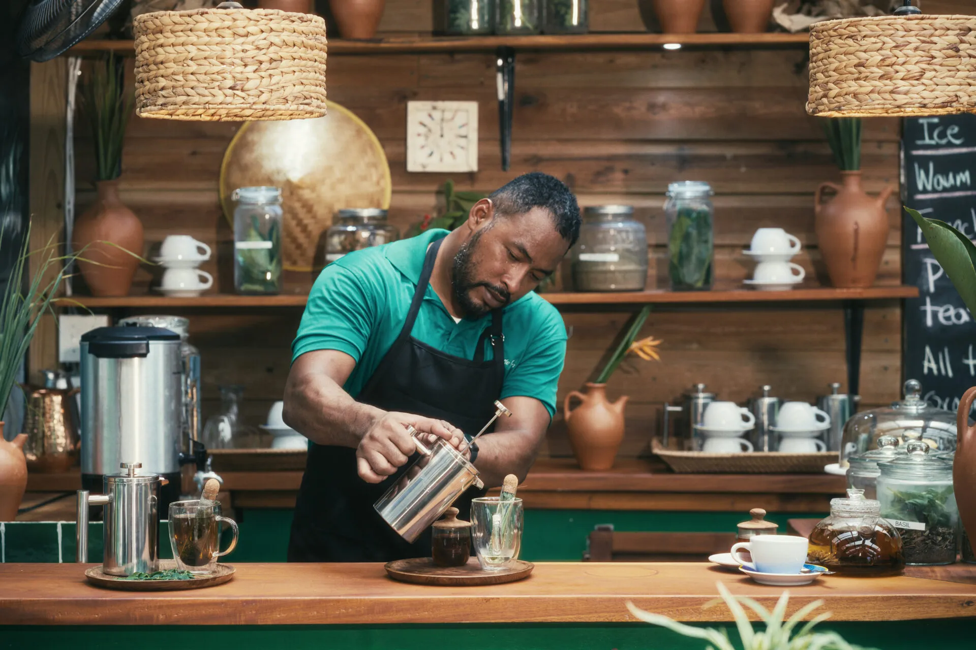 Tea Master Ian Flowers pouring tea at The Tea House, Turtle Inn
